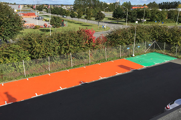 Orange and green parking spot markings